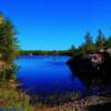 One of many such beautiful blue lakes-in Manitoba's 'southeastern rocky woods'
