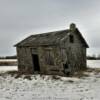 Very modest 1920's
rural ranch house.
Near Corning, SK.