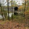 A view through the woods of
the Thompson Mill Covered Bridge.