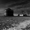 B&W of a pristine farm field
with early quonset buildings.
Monona County.