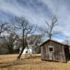 Belvidere, Kansas.
Squatters hut & outhouse.