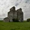 Twin rustic 1930's 
crib-style grain elevators.
Arena, ND.