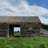 'House through a barn.'
Near Pingree.