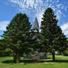 Classic old church 
lurking behind the pines in
Hamberg, ND.